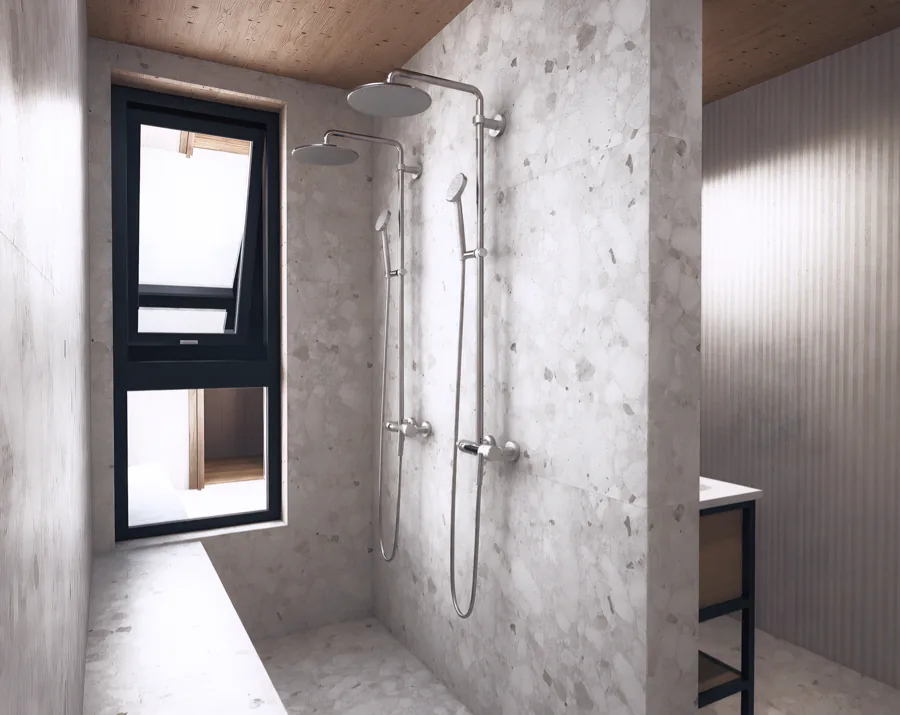 Baño con luz natural y superficies minerales